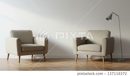 Two comfortable armchairs face each other in a minimalist living room with a modern floor lamp, bathed in natural light from a window casting a soft shadow. 137118372