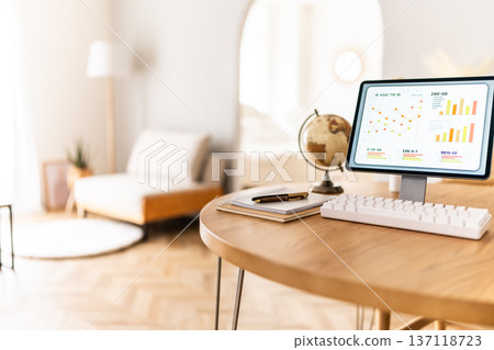 Desk and tablet in a bright room 137118723
