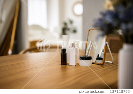 Cosmetics lined up on the table 137118763