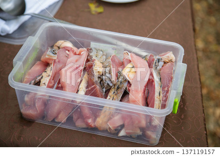 Raw sliced fish prepared for cooking Raw sliced fish prepared for cooking 137119157