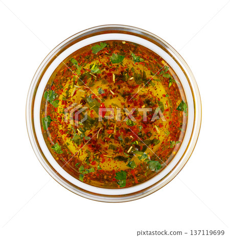 Chimichurri sauce in bowl with herbs and spices 137119699
