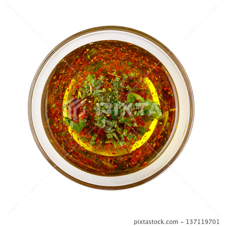 Chimichurri sauce with herbs and chili flakes in glass bowl Chimichurri sauce with herbs and chili flakes in glass bowl 137119701