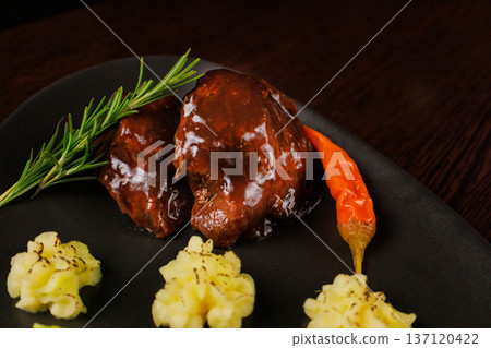 Fried meat on a plate with different sauces and Fried meat on a plate with different sauces and 137120422