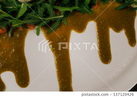 A plate with sliced red fish, bread and greens A plate with sliced red fish, bread and greens 137120426