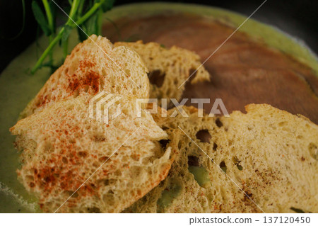 Cream soup with pieces of beef and herbs Cream soup with pieces of beef and herbs 137120450