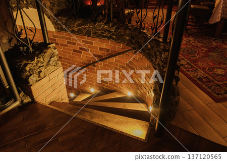 A beautiful staircase in a cafe with cozy lighting A beautiful staircase in a cafe with cozy lighting 137120565