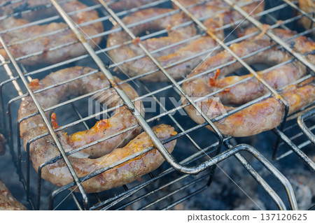 Kebabs and sausages are being grilled on the grill Kebabs and sausages are being grilled on the grill 137120625
