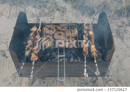 Kebabs and sausages are being grilled on the grill Kebabs and sausages are being grilled on the grill 137120627