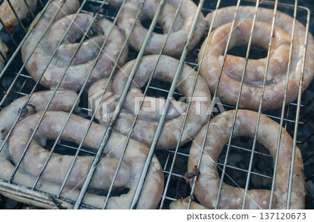 Kebabs and sausages are being grilled on the grill Kebabs and sausages are being grilled on the grill 137120673