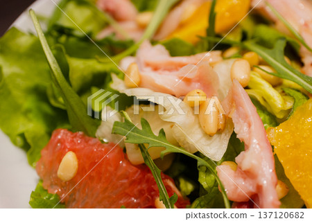 Chicken salad with grapefruit greens on a plate 137120682