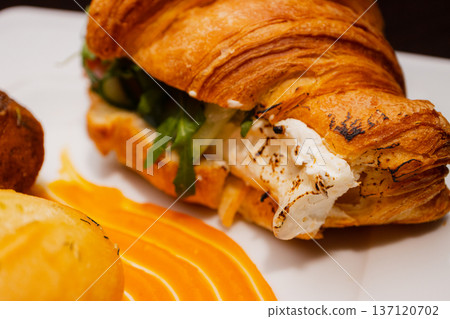 Croissant with salmon and stuffed buns on a plate Croissant with salmon and stuffed buns on a plate 137120702