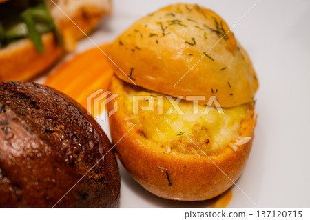 Croissant with salmon and stuffed buns on a plate Croissant with salmon and stuffed buns on a plate 137120715