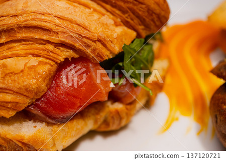 Croissant with salmon and stuffed buns on a plate Croissant with salmon and stuffed buns on a plate 137120721