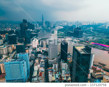 sunset over modern Ho Chi Minh city skyline and Saigon river, financial downtown district with high-rise skyscraper towers, Hochiminh Vietnam aerial drone view 4k sunset over modern Ho Chi Minh city skyline and Saigon river, financial downtown district with high-rise skyscraper towers, Hochiminh Vietnam aerial drone view 4k 137120756
