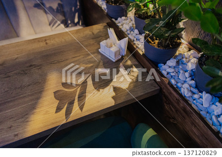 Beautiful wooden table in a restaurant with cozy Beautiful wooden table in a restaurant with cozy 137120829