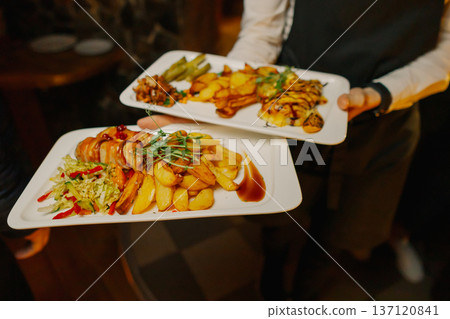 Fried potato and meat roll dishes on a plate Fried potato and meat roll dishes on a plate 137120841