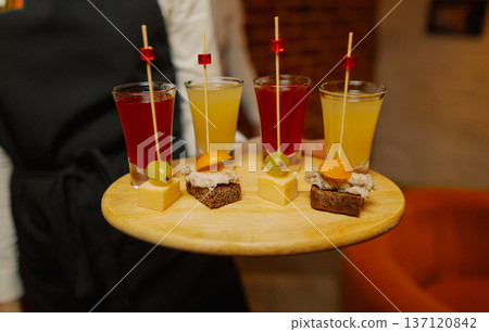 Liqueurs of different colors in shot glasses Liqueurs of different colors in shot glasses 137120842