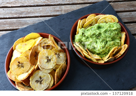 Plantain Patacones with Guacamole Dip Plantain Patacones with Guacamole Dip 137120918