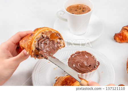 Croissant with Chocolate Cream and Coffee Breakfast Croissant with Chocolate Cream and Coffee Breakfast 137121110