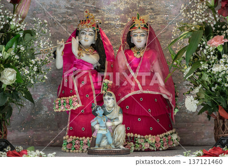 The statue features the Hindu deities Radha and Krishna. The display is a form of worship and a way to celebrate the Navaratri festival. The statue features the Hindu deities Radha and Krishna. The display is a form of worship and a way to celebrate the Navaratri festival. 137121460
