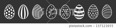 Set of silhouettes of Easter eggs on a dark background. Set of silhouettes of Easter eggs on a dark background. 137121655