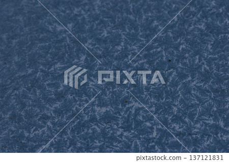 Abstract winter frost texture with delicate ice crystal patterns on a frozen surface. Natural icy background with snowflake-like details, perfect for seasonal designs, cold weather concepts 137121831
