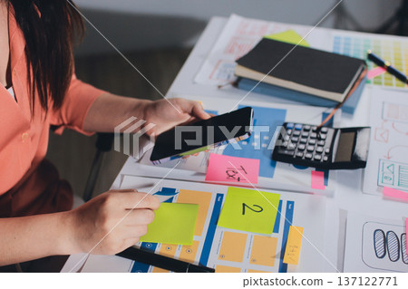 team of UI UX web designer are working together to develop mobile responsive websites with UI UX front end designer previews 137122771