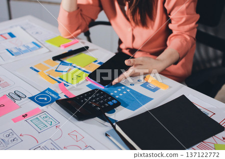 team of UI UX web designer are working together to develop mobile responsive websites with UI UX front end designer previews 137122772