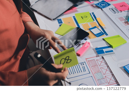 team of UI UX web designer are working together to develop mobile responsive websites with UI UX front end designer previews team of UI UX web designer are working together to develop mobile responsive websites with UI UX front end designer previews 137122779