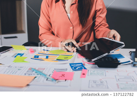 team of UI UX web designer are working together to develop mobile responsive websites with UI UX front end designer previews 137122782