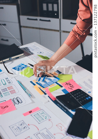 team of UI UX web designer are working together to develop mobile responsive websites with UI UX front end designer previews 137122798