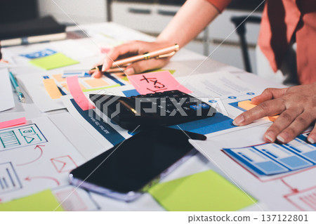 team of UI UX web designer are working together to develop mobile responsive websites with UI UX front end designer previews 137122801