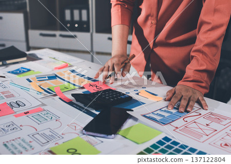 team of UI UX web designer are working together to develop mobile responsive websites with UI UX front end designer previews 137122804