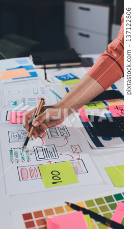 team of UI UX web designer are working together to develop mobile responsive websites with UI UX front end designer previews 137122806