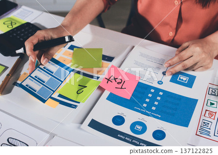 team of UI UX web designer are working together to develop mobile responsive websites with UI UX front end designer previews 137122825