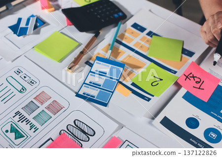 team of UI UX web designer are working together to develop mobile responsive websites with UI UX front end designer previews 137122826