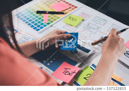 team of UI UX web designer are working together to develop mobile responsive websites with UI UX front end designer previews 137122833