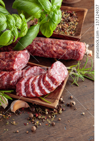 Sliced smoked sausage with herbs and spices. Sliced smoked sausage with herbs and spices. 137124037
