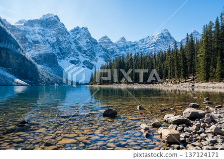 Moraine Lake and the reflection of the snow-capped Ten Peaks on a sunny autumn morning in Banff National Park Moraine Lake and the reflection of the snow-capped Ten Peaks on a sunny autumn morning in Banff National Park 137124171