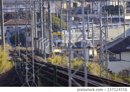 Gunma: A local train running through residential areas Gunma: A local train running through residential areas 137124558