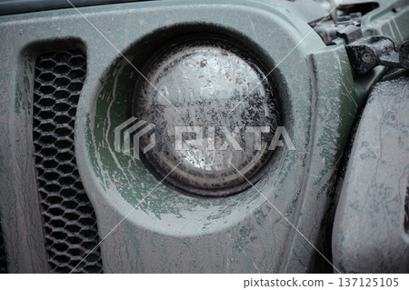 Dirty Off Road Vehicle Headlight Close Up After Mud Drive 137125105