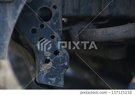 Close Up of Worn Car Suspension Frame Detailed view of aged vehicle chassis metal parts with dirt corrosion and mechanical structure texture 137125238