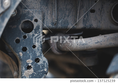 Close Up of Worn Car Suspension Frame Detailed view of aged vehicle chassis metal parts with dirt corrosion and mechanical structure texture Close Up of Worn Car Suspension Frame Detailed view of aged vehicle chassis metal parts with dirt corrosion and mechanical structure texture 137125239