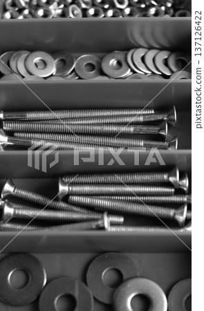 Hardware Items Is Arranged By Type In The Separated Cells In Plastic Case Angle View Hardware Items Is Arranged By Type In The Separated Cells In Plastic Case Angle View 137126422