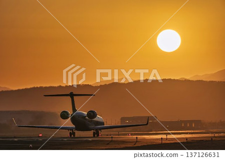 Sendai Airport at dusk: Sunset and planes taking off, Natori City, Miyagi Prefecture Sendai Airport at dusk: Sunset and planes taking off, Natori City, Miyagi Prefecture 137126631