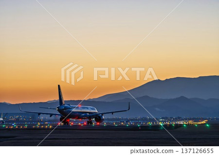 Sendai Airport at dusk: Sunset and planes taking off, Natori City, Miyagi Prefecture Sendai Airport at dusk: Sunset and planes taking off, Natori City, Miyagi Prefecture 137126655