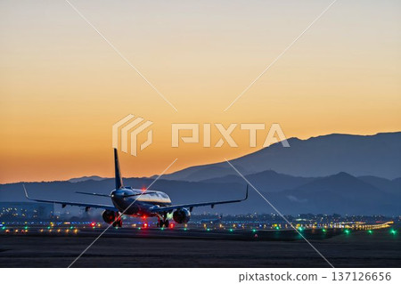 Sendai Airport at dusk: Sunset and planes taking off, Natori City, Miyagi Prefecture Sendai Airport at dusk: Sunset and planes taking off, Natori City, Miyagi Prefecture 137126656