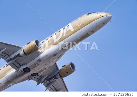 Sendai Airport in winter, blue sky and airplane taking off, Natori City, Miyagi Prefecture 137126685