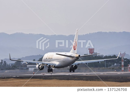 Sendai Airport at dusk, airplane taking off, Natori City, Miyagi Prefecture Sendai Airport at dusk, airplane taking off, Natori City, Miyagi Prefecture 137126708
