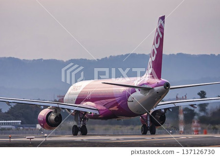 Sendai Airport at dusk, airplane taking off, Natori City, Miyagi Prefecture 137126730